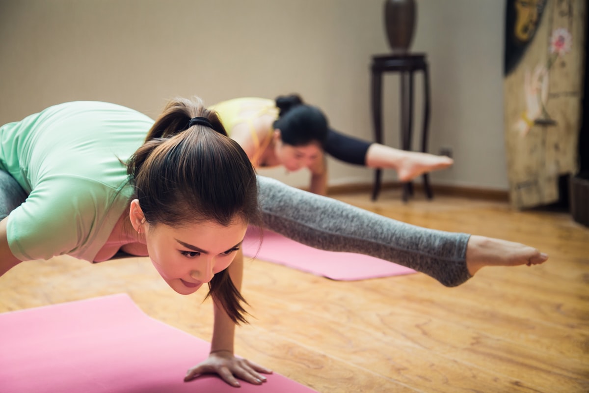Practitioner stretching in a sunlit room
